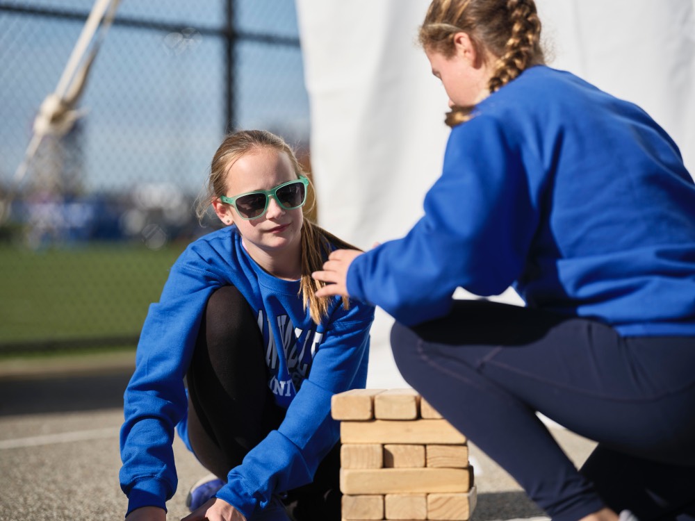 2 young girls playing Jenga together